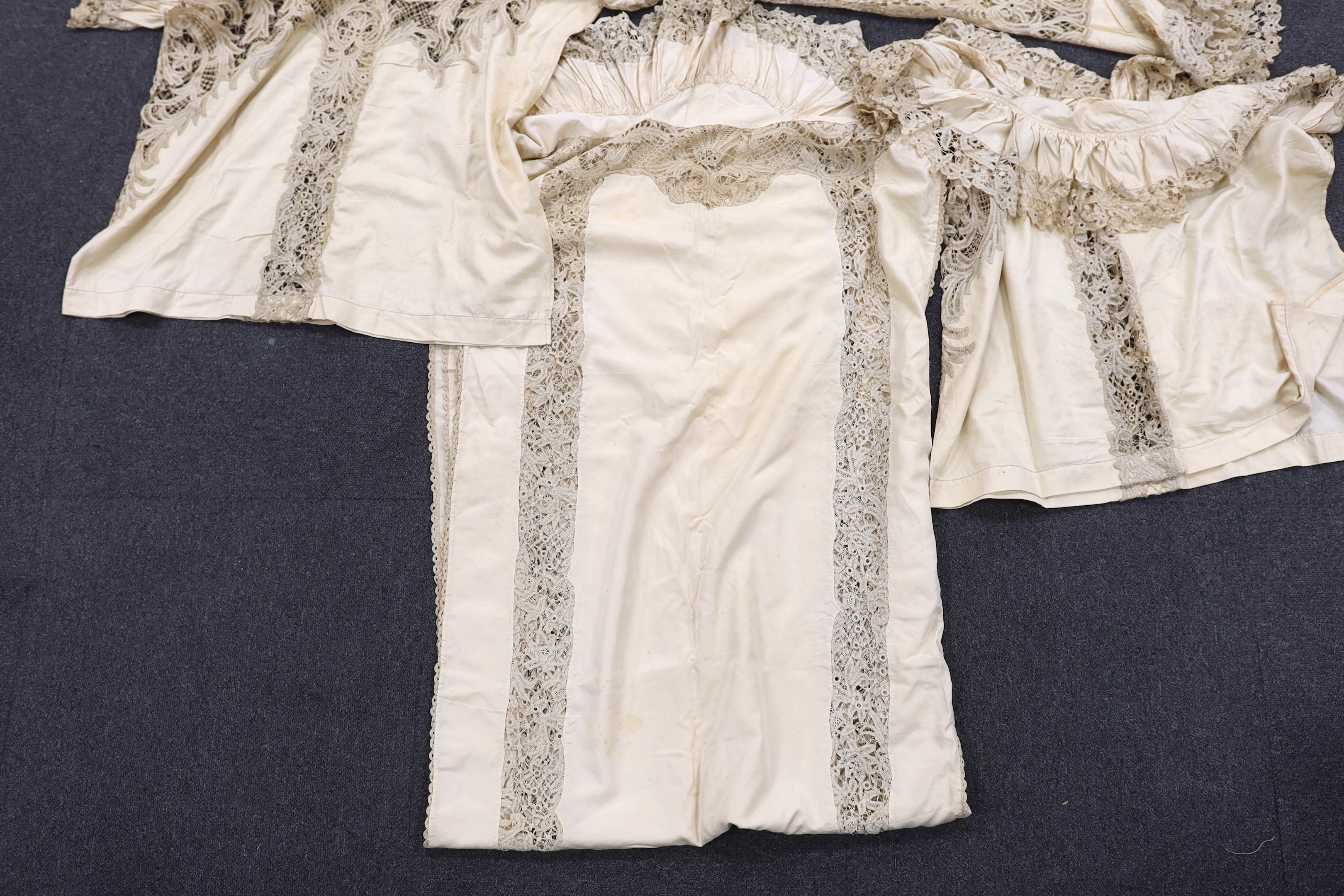 One long cream silk curtain decorated with tape lace insertions and frilled border, 226cm long x 134cm wide, together with three small curtains, 135cm x 74cm deep